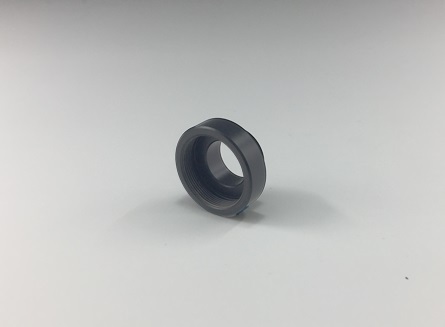 Adapter soczewki obiektywowej do klatki